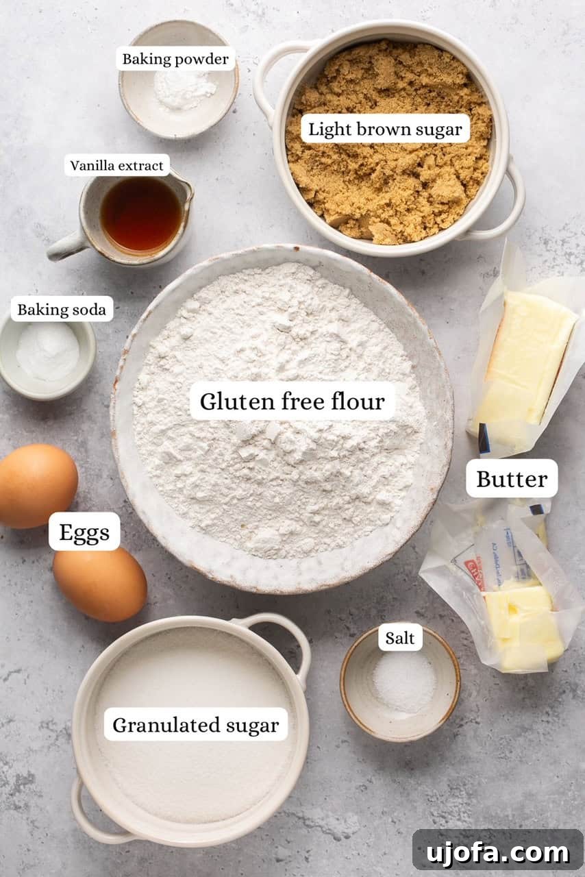 Ingredients for chocolate chipless cookies laid out, including butter, sugars, eggs, vanilla, and gluten-free flour blend.