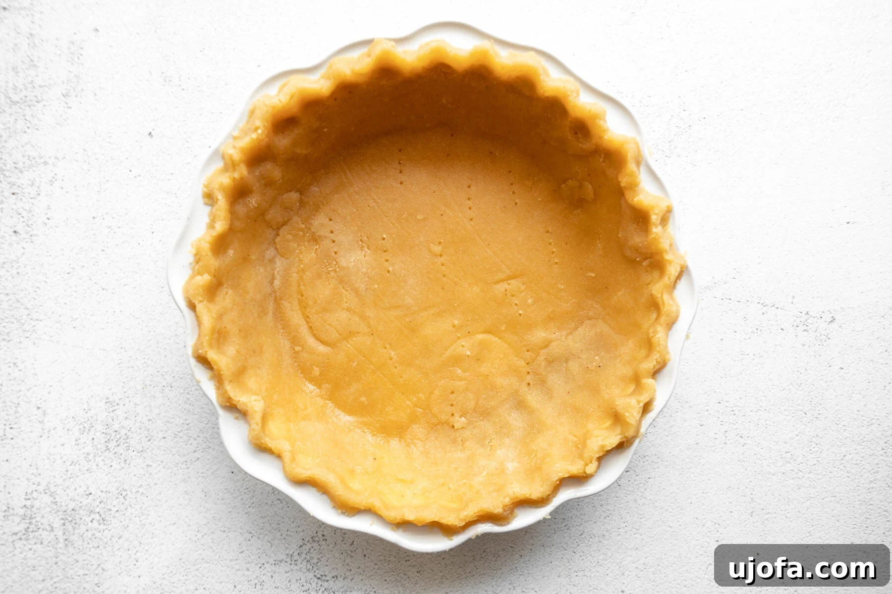 Gluten-Free Almond Flour Pie Crust process shot: baked crust in pie pan.