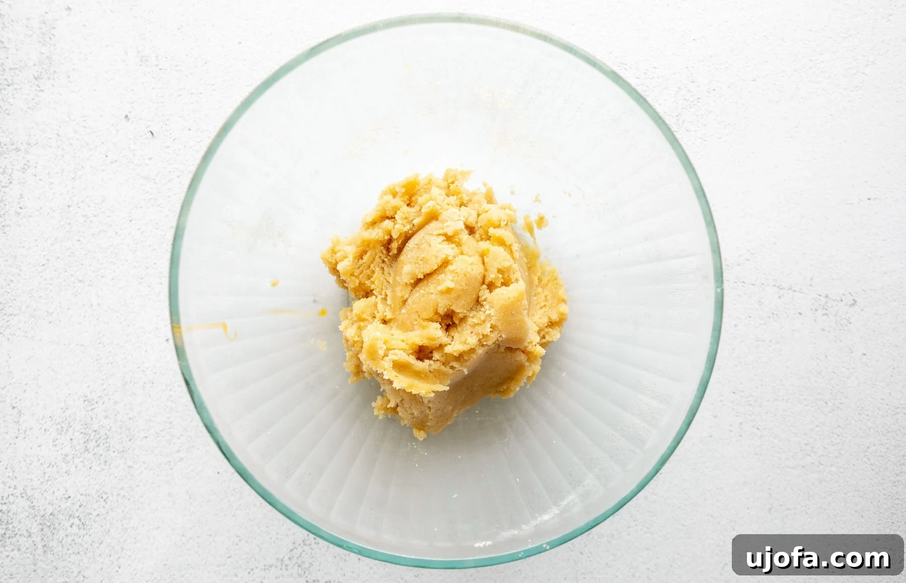 Gluten-Free Almond Flour Pie Crust process shot: adding wet ingredients.