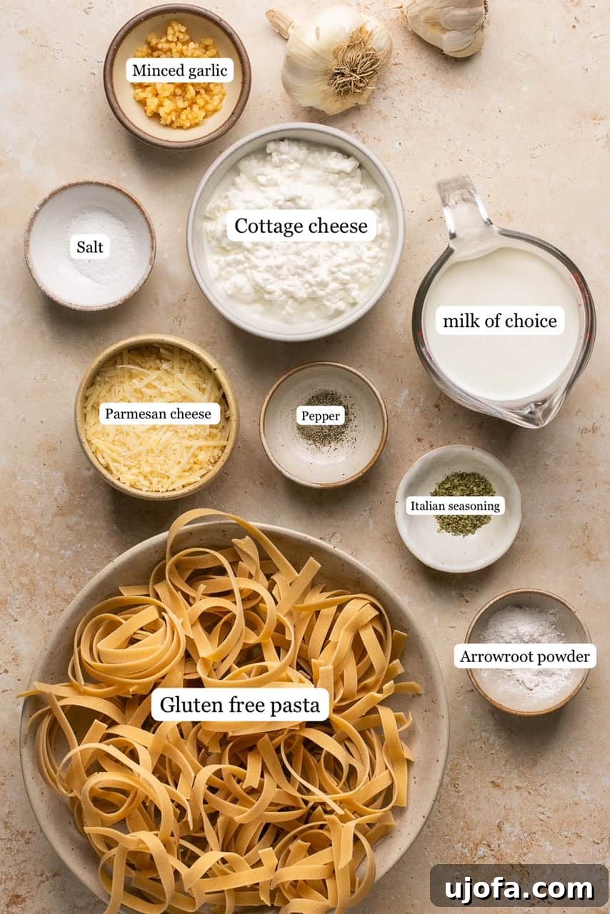Individual ingredients for Cottage Cheese Alfredo arranged in small nesting bowls, showcasing their freshness and readiness for blending.