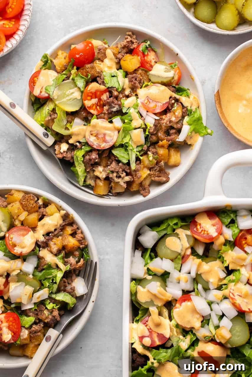 Two bowls filled with Big Mac Casserole, portioned out and ready to be served, demonstrating the generous yield of the recipe.