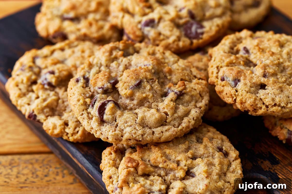 Delicious gluten-free oatmeal cookies arranged neatly on a rustic cutting board, highlighting their golden-brown edges and soft centers, ready to be enjoyed.