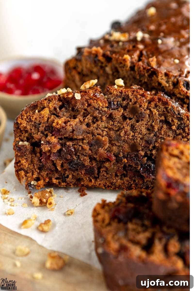 Sumptuous Gluten-Free Fruitcake 5 Interior of a slice of Gluten-Free Fruit Cake, showing the distribution of fruits and nuts and its moist texture.