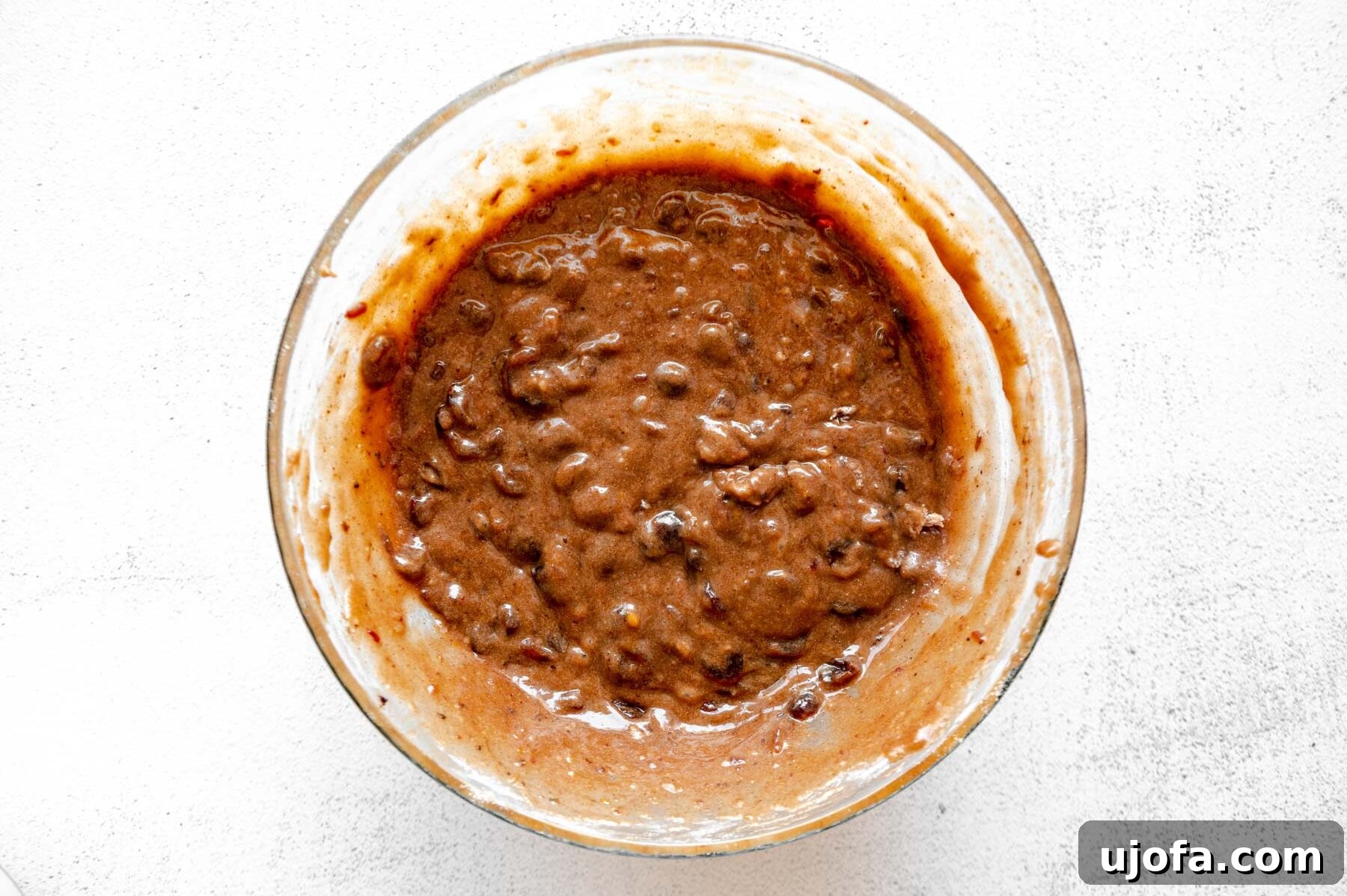 Sumptuous Gluten-Free Fruitcake 8 Batter for gluten-free fruit cake in a glass mixing bowl, after dry ingredients have been incorporated.