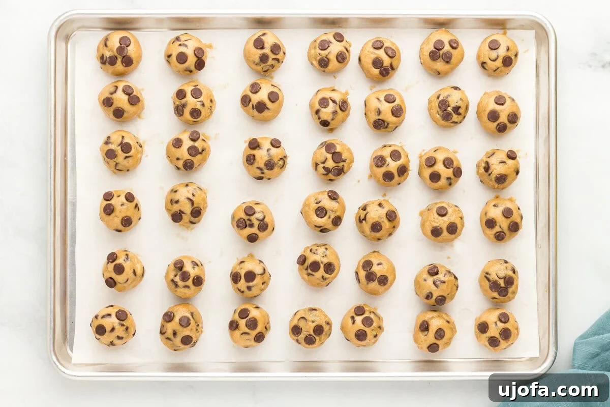Wholesome Oat Chocolate Chip Treats 11 Ball of oat flour chocolate chip cookie dough on a baking sheet.