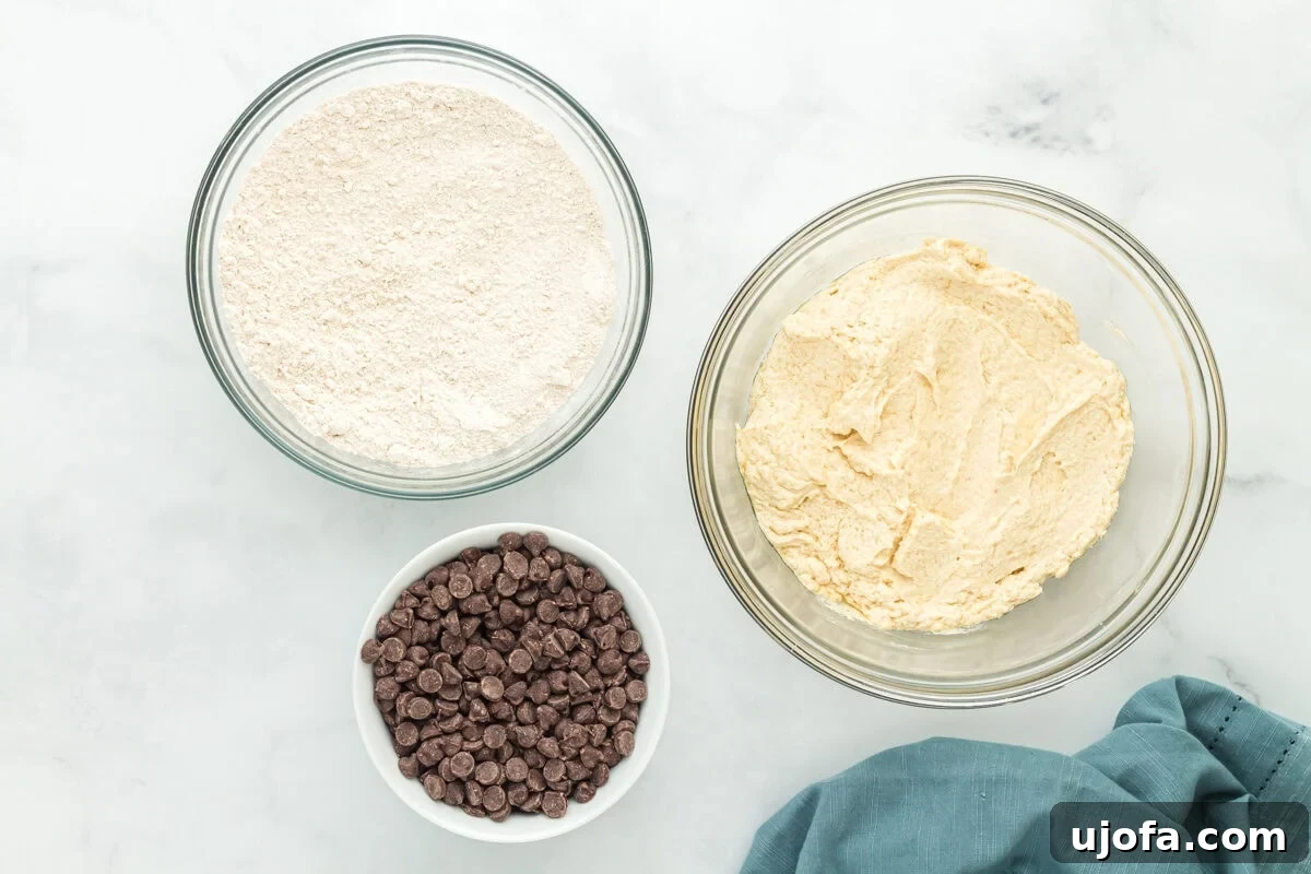 Wholesome Oat Chocolate Chip Treats 7 Dry and wet ingredients for oat flour chocolate chip cookies in separate bowls.