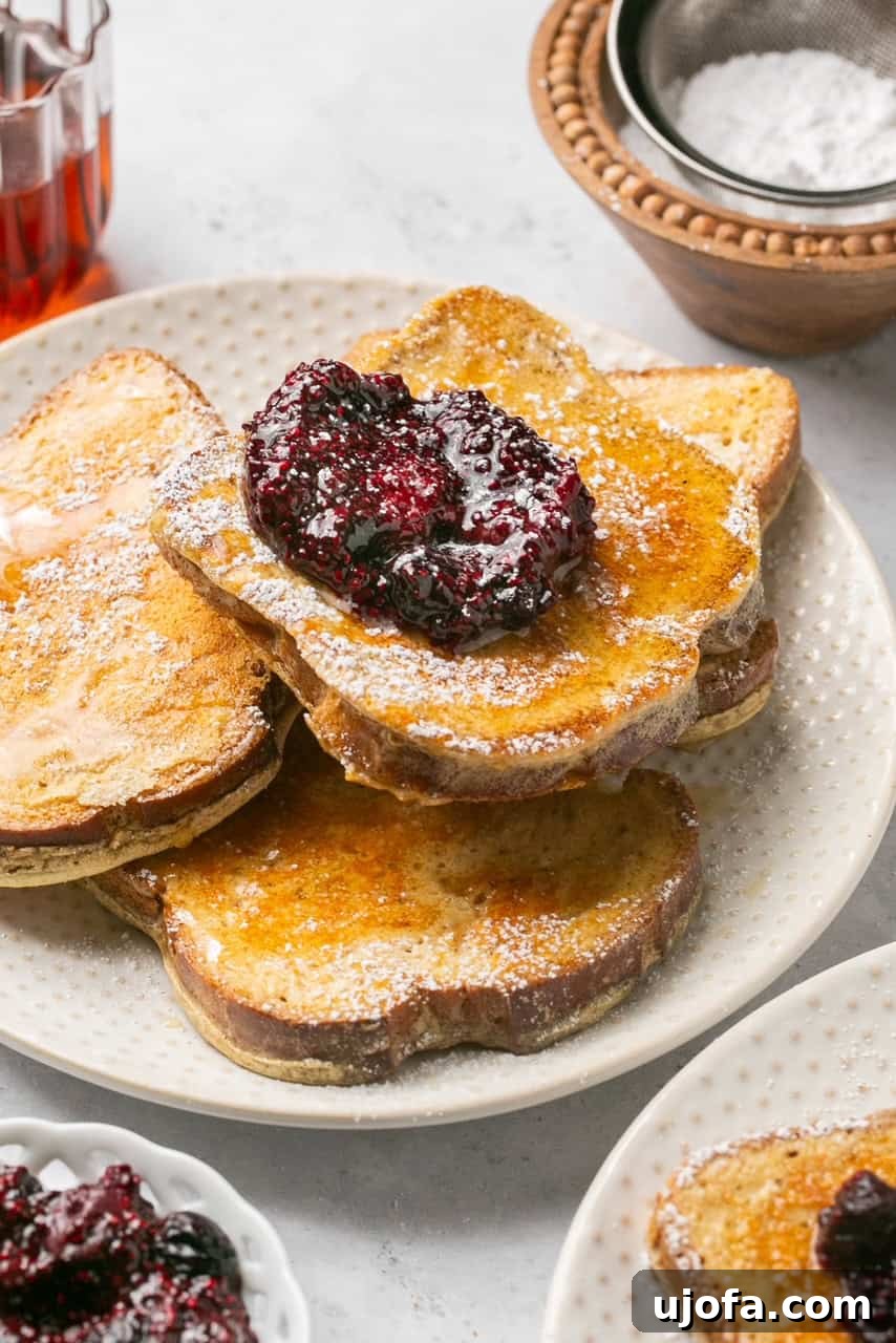 4 slices of french toast on a plate topped with chia jam