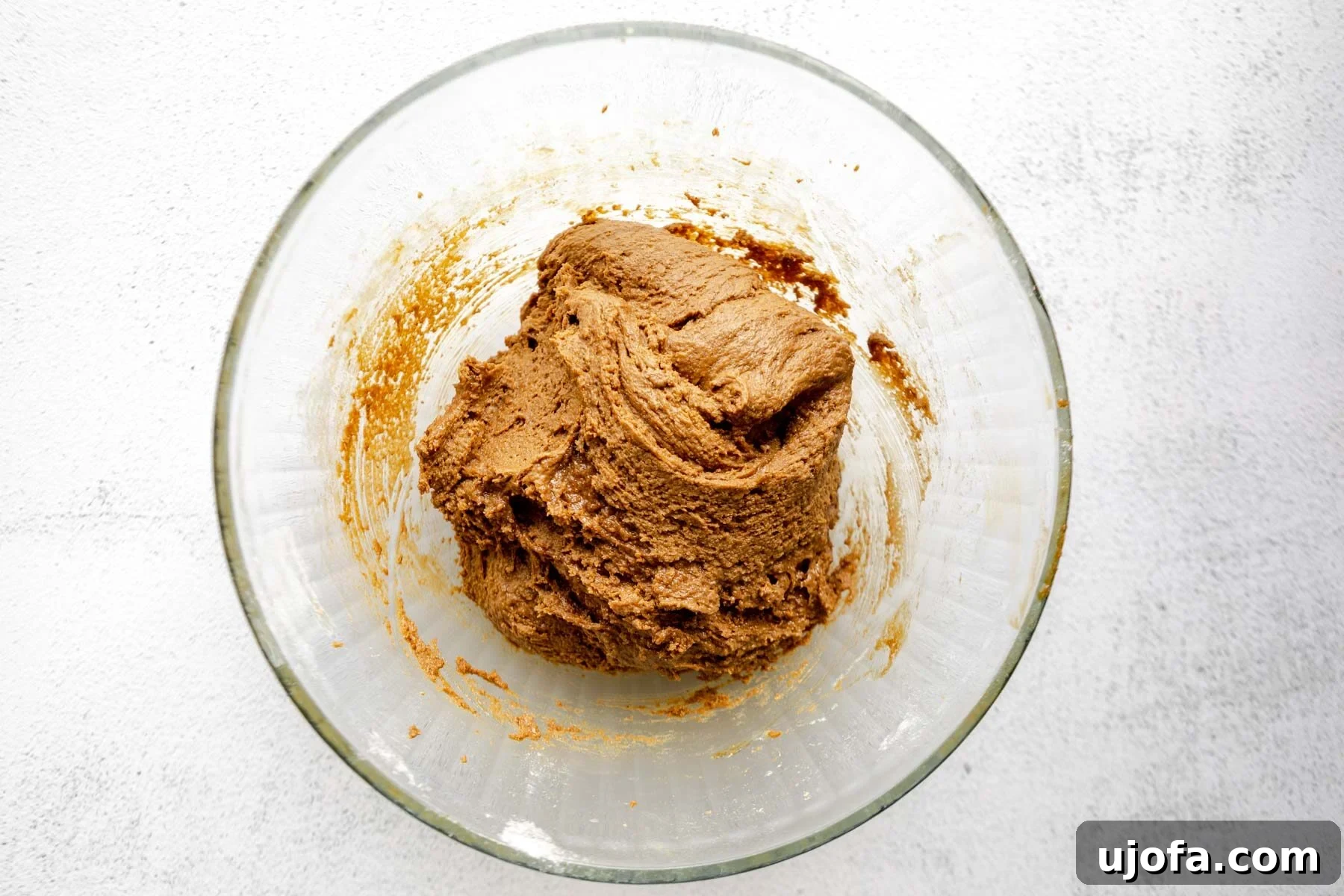 Soft & Chewy Gluten-Free Molasses Spice Cookies 8 The fully mixed gluten-free molasses cookie dough in a glass mixing bowl, showing its rich color and smooth consistency.