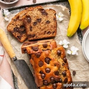 Protein banana bread with chocolate chips on a parchment-lined baking sheet.