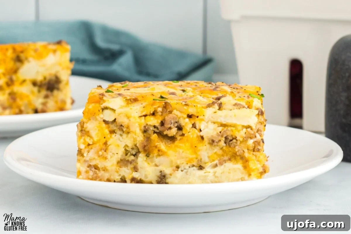 easy gluten-free breakfast casserole slice on a white plate with the casserole in the background