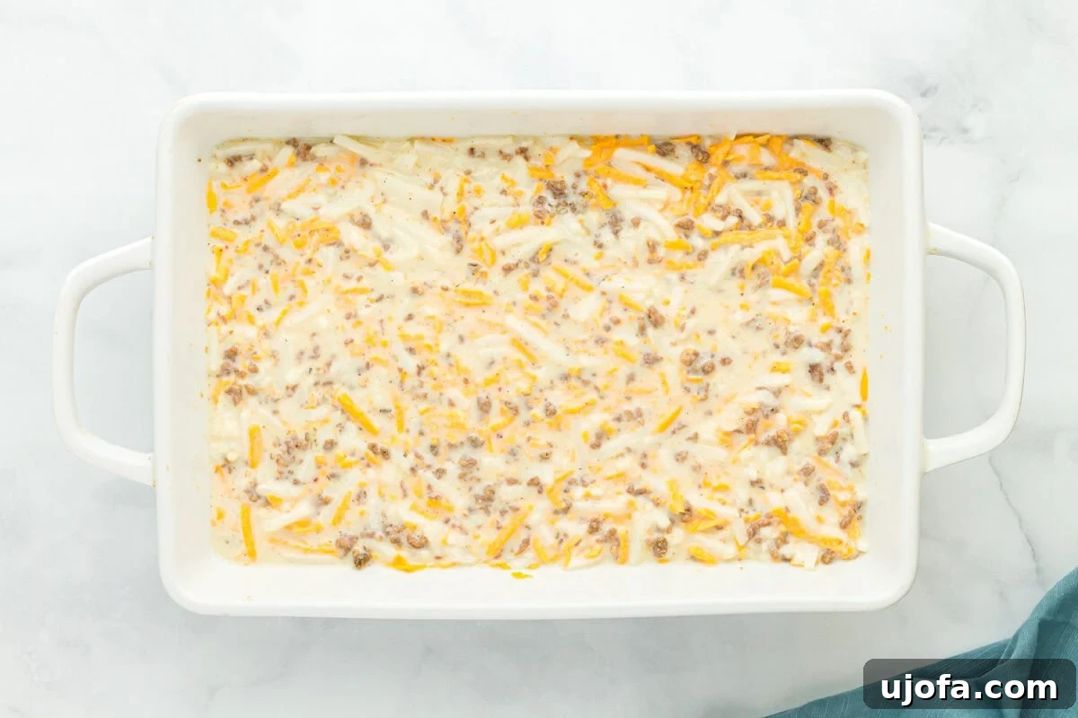 unbaked gluten-free breakfast casserole in a baking pan.