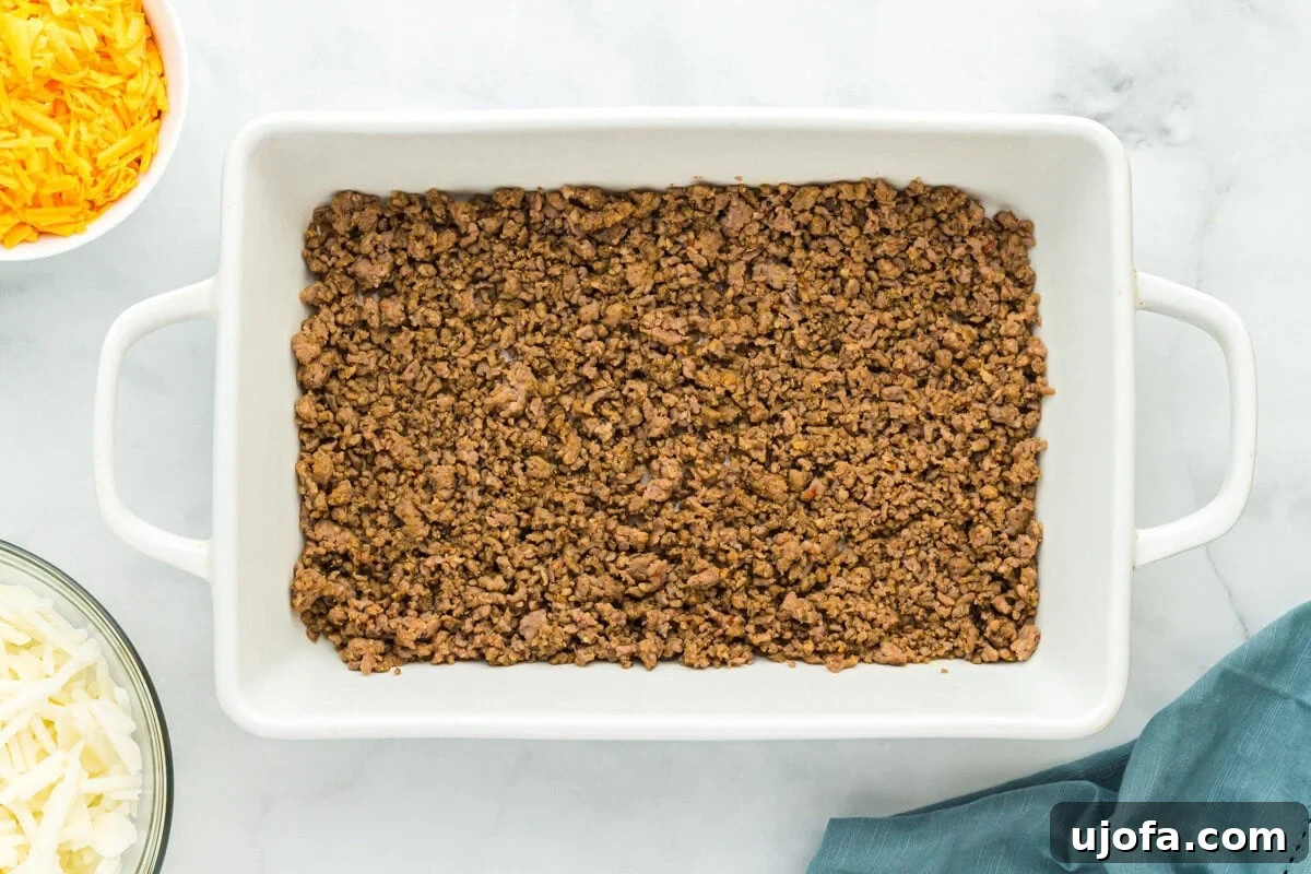 cooked ground sausage in a baking pan.