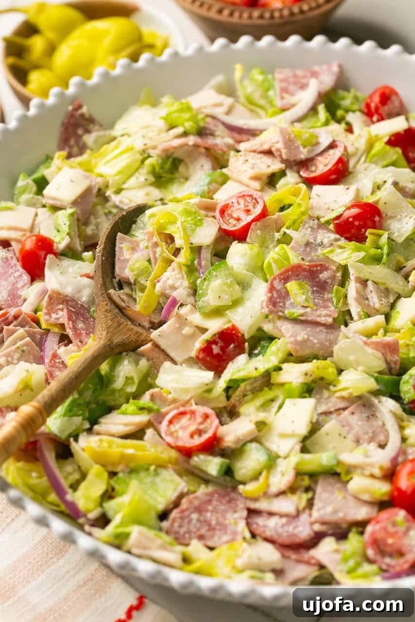 an up close photo of a grinder salad in a white serving bowl.