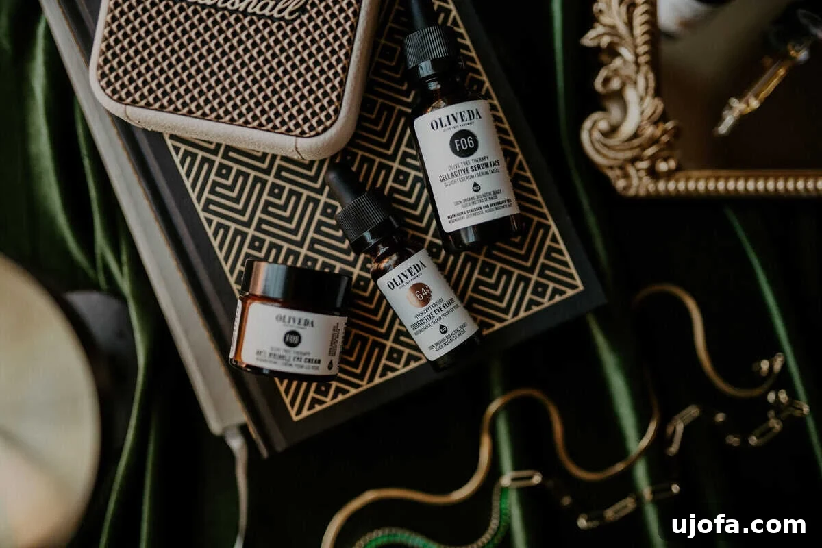 Oliveda products laid out on a table with decorative items