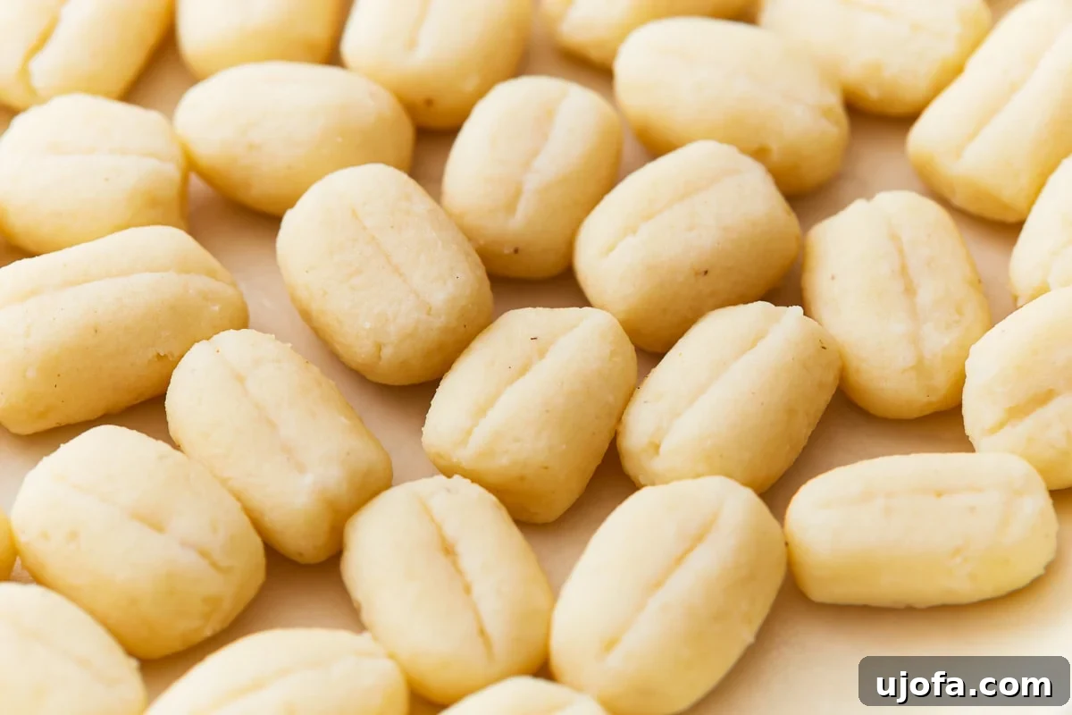 Fluffy Gluten Free Gnocchi 2 Gluten-free gnocchi on a parchment paper.