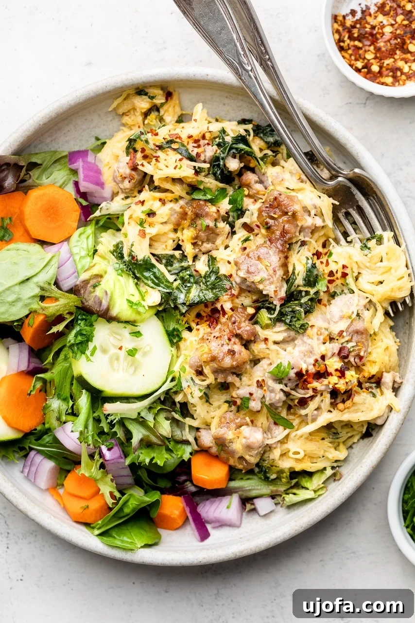 Rustic Tuscan Spaghetti Squash Bake 5 A bowl of spaghetti squash casserole with a salad on the side
