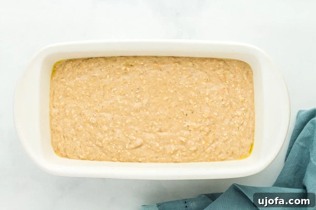 Wholesome Banana Bliss 9 Flourless banana bread batter freshly poured into a baking dish, ready for the oven.
