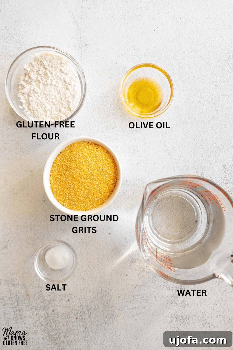 Golden Fried Grits 4 A collection of the five essential ingredients laid out for making delicious grit cakes: water, salt, stone-ground grits, gluten-free flour, and olive oil.