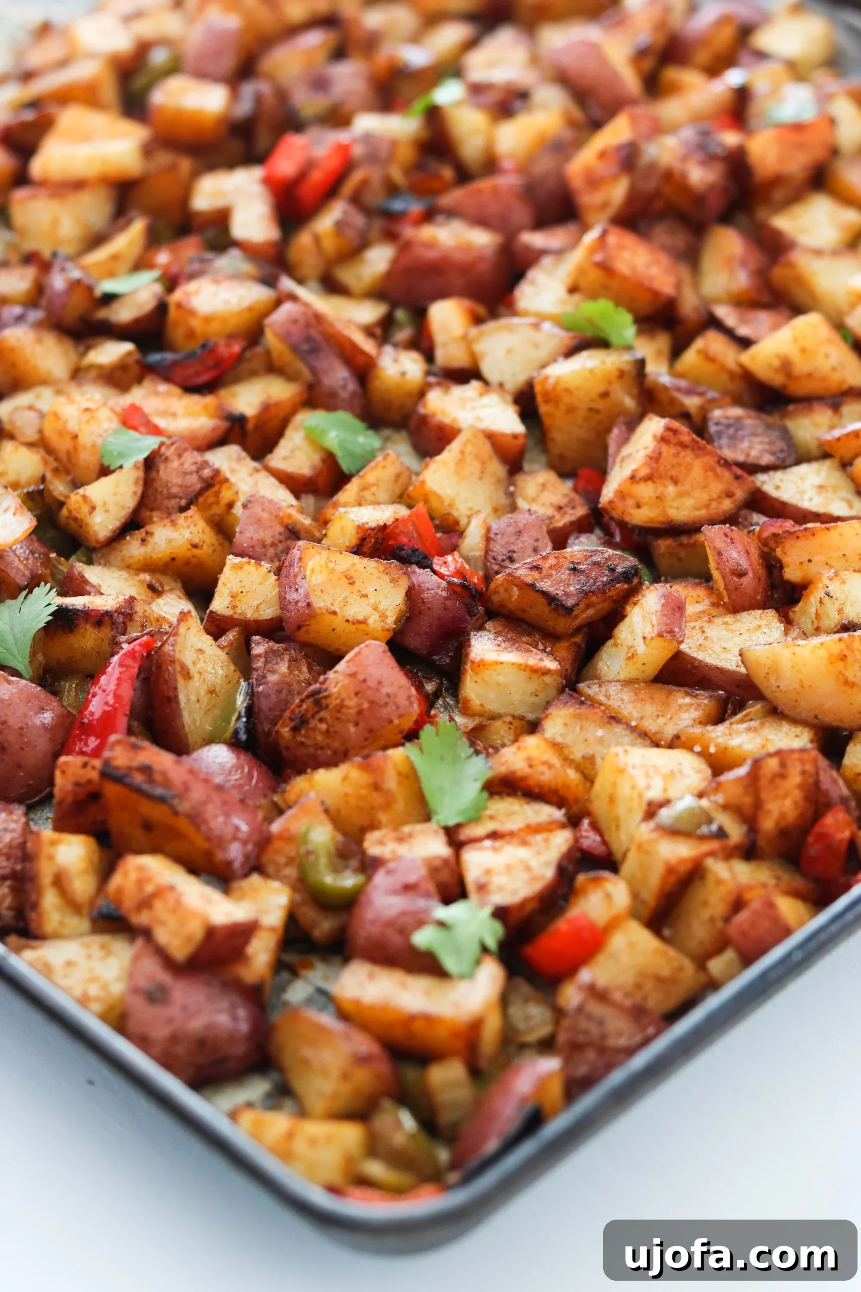 Sheet Pan Southwest Breakfast Potatoes baking in the oven