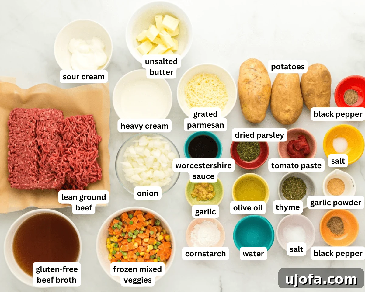 Hearty Gluten-Free Shepherd's Pie 3 A flat lay photograph showcasing all the fresh ingredients needed for a gluten-free shepherd's pie, including ground beef, vegetables, herbs, and potatoes.
