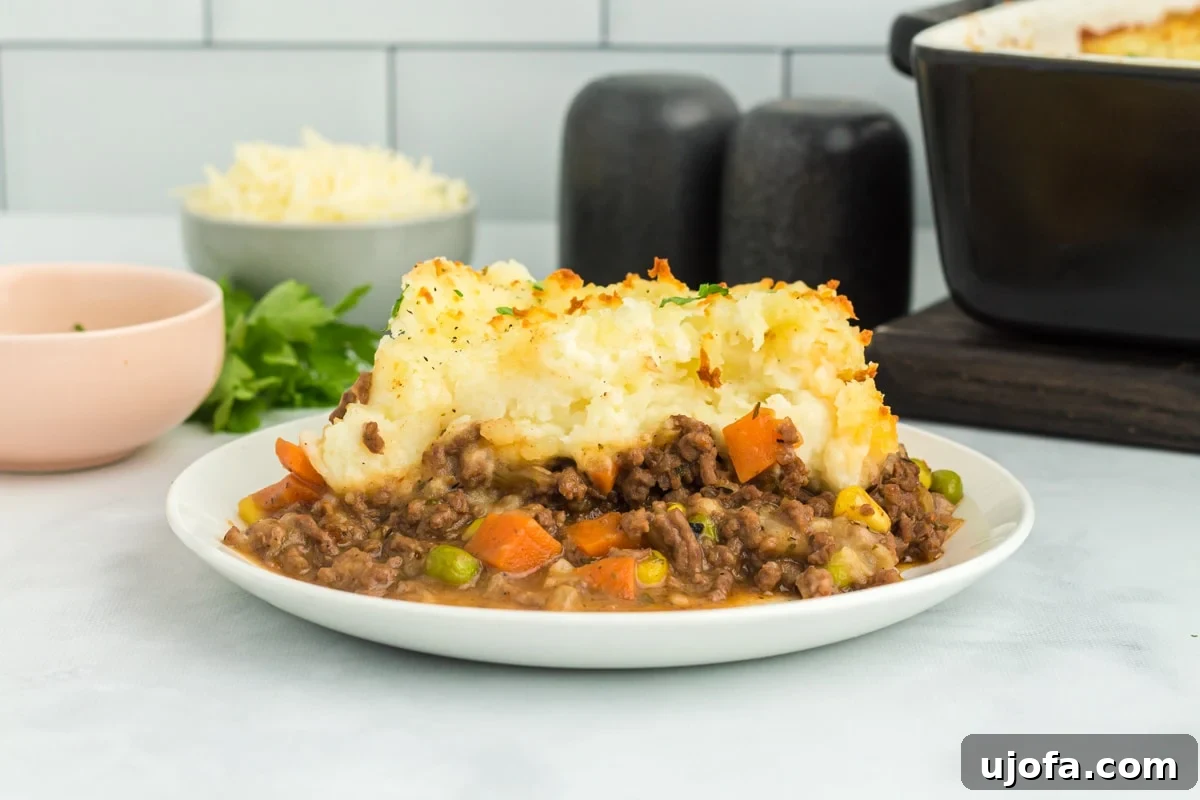 Hearty Gluten-Free Shepherd's Pie 7 A delicious serving of gluten-free shepherd's pie ready to be enjoyed on a white plate.