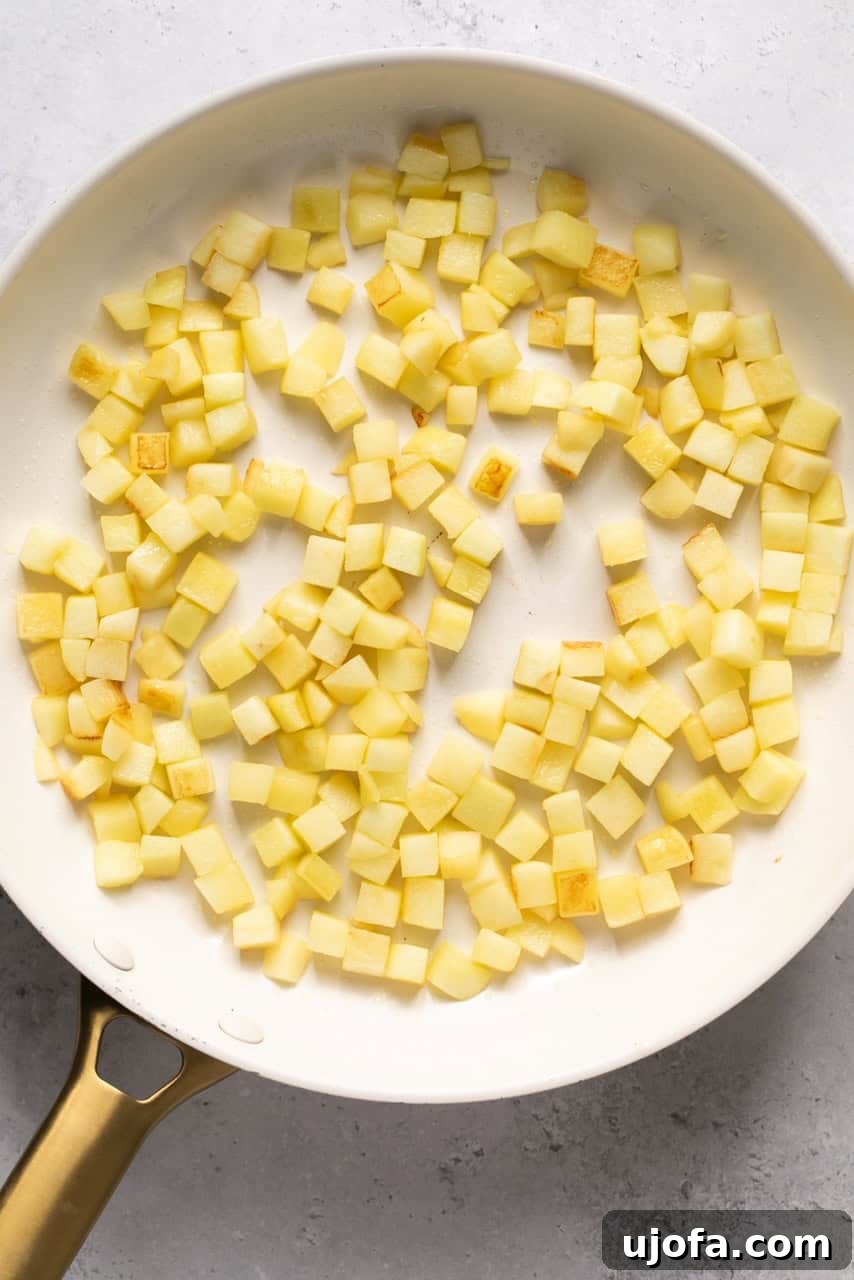 Perfect Caramel Apples Made Simple 5 chopped apples in a skillet
