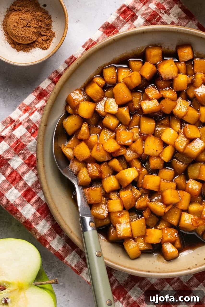 Perfect Caramel Apples Made Simple 8 a bowl of chopped apples in a caramelized sauce