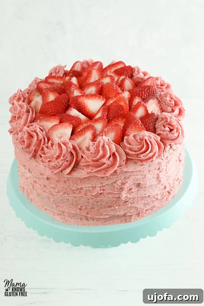 Delicious Gluten-Free Cake Delights 4 gluten-free strawberry cake on a blue cake stand with a white background