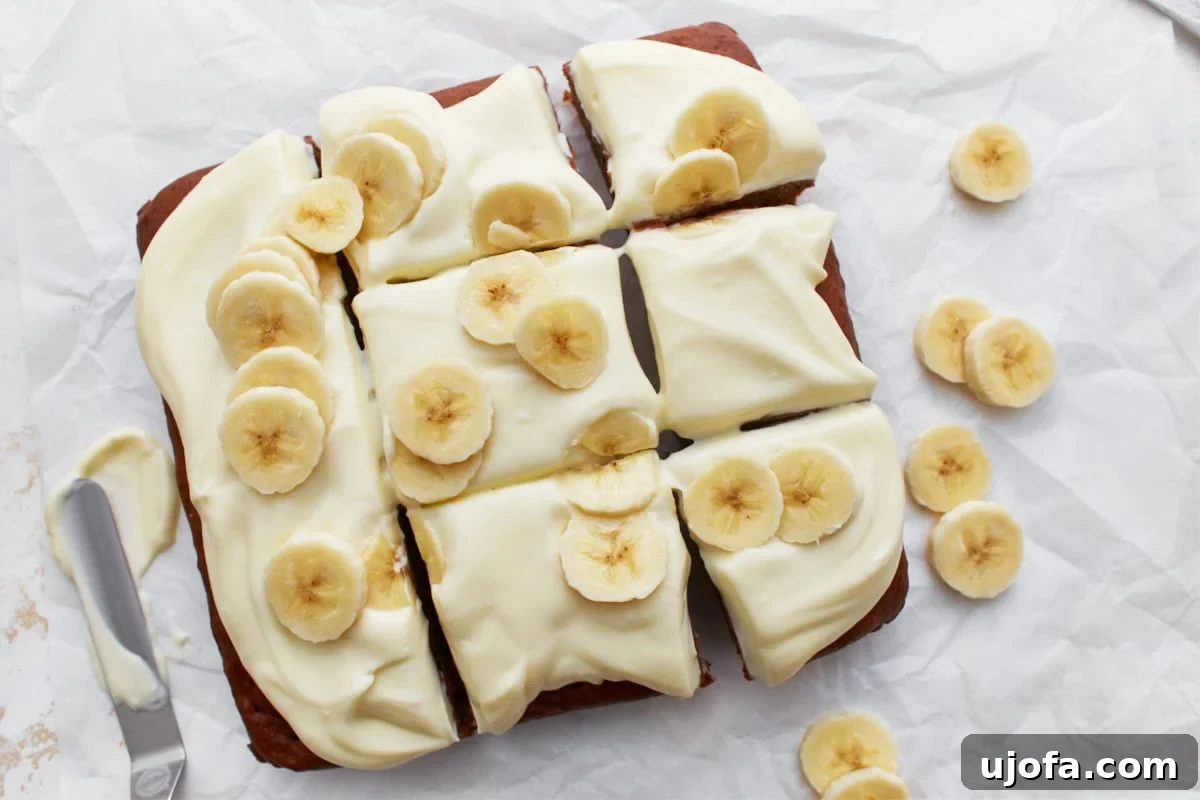 Delicious Gluten-Free Cake Delights 7 Gluten-free banana cake sliced and topped with cream cheese frosting and fresh banana slices on white parchment paper