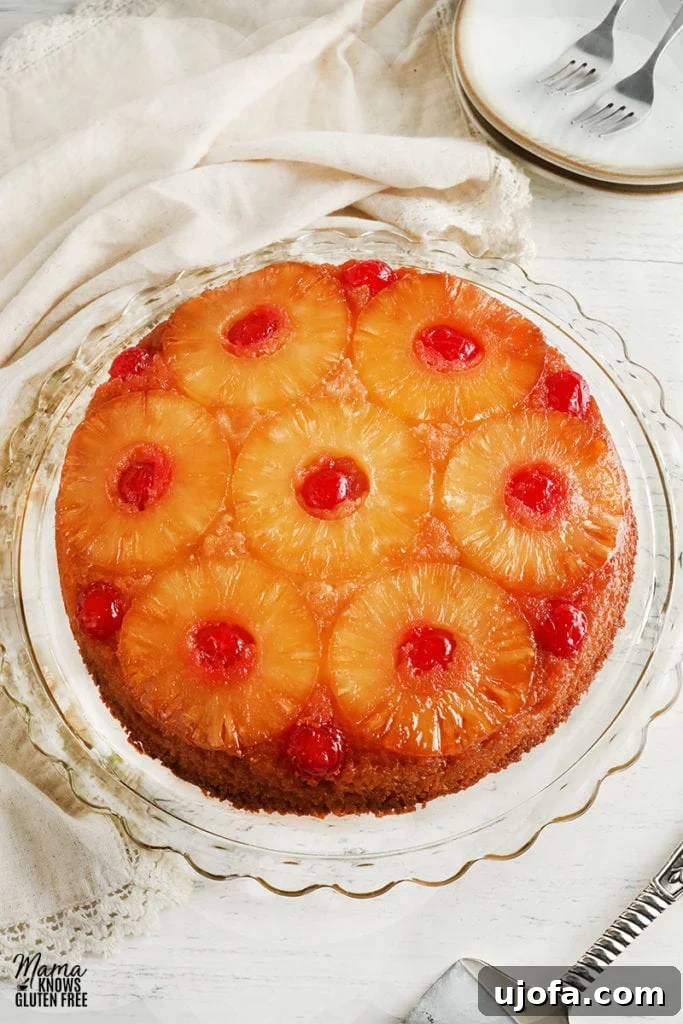 Delicious Gluten-Free Cake Delights 9 gluten-free pineapple upside down cake on a cake plate with plates and cake cutter in the background