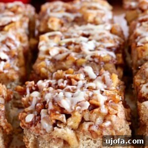 gluten-free apple pie blondies with red apples in the background