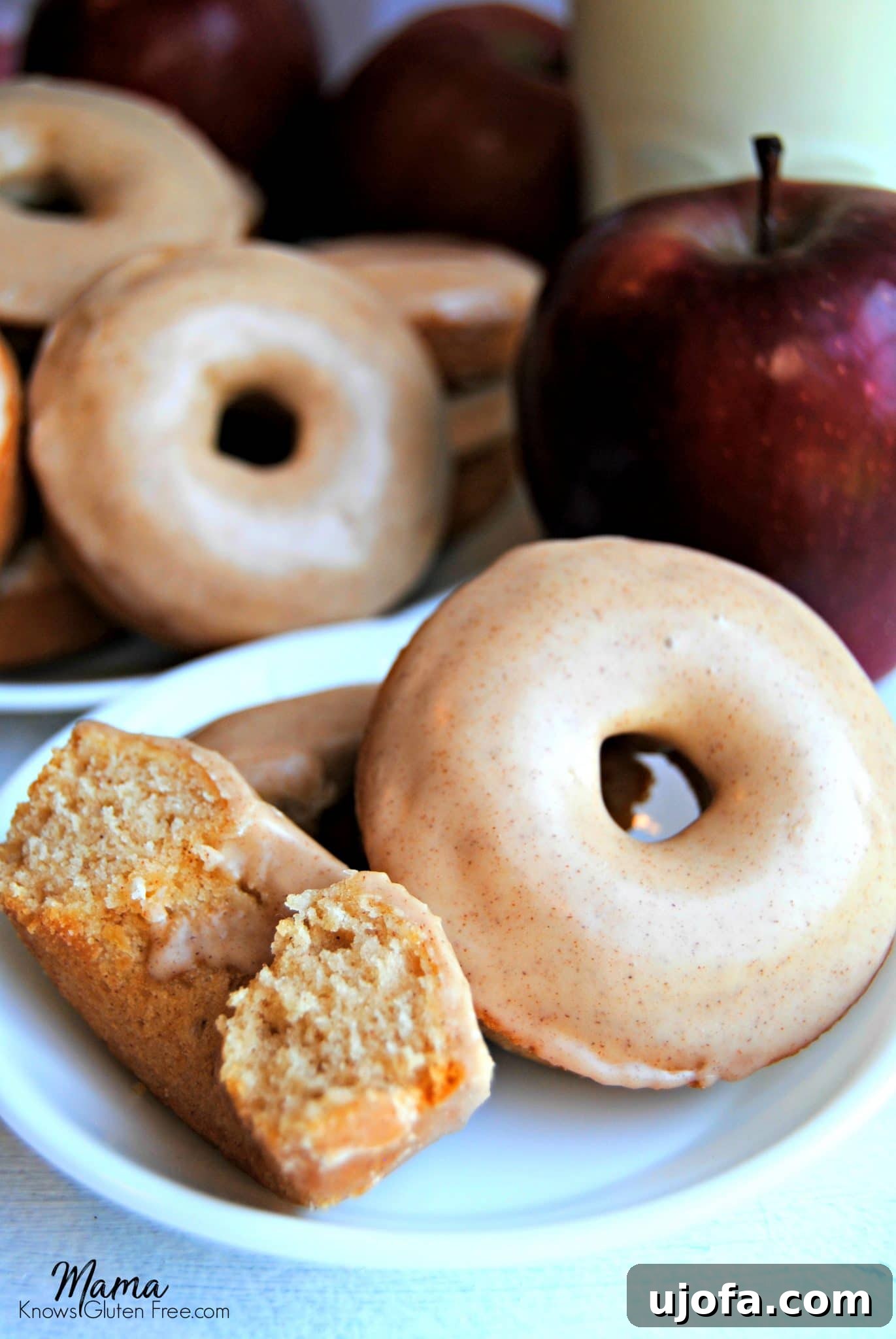 Delicious baked gluten-free apple cinnamon donuts with maple glaze, perfectly golden brown and inviting.