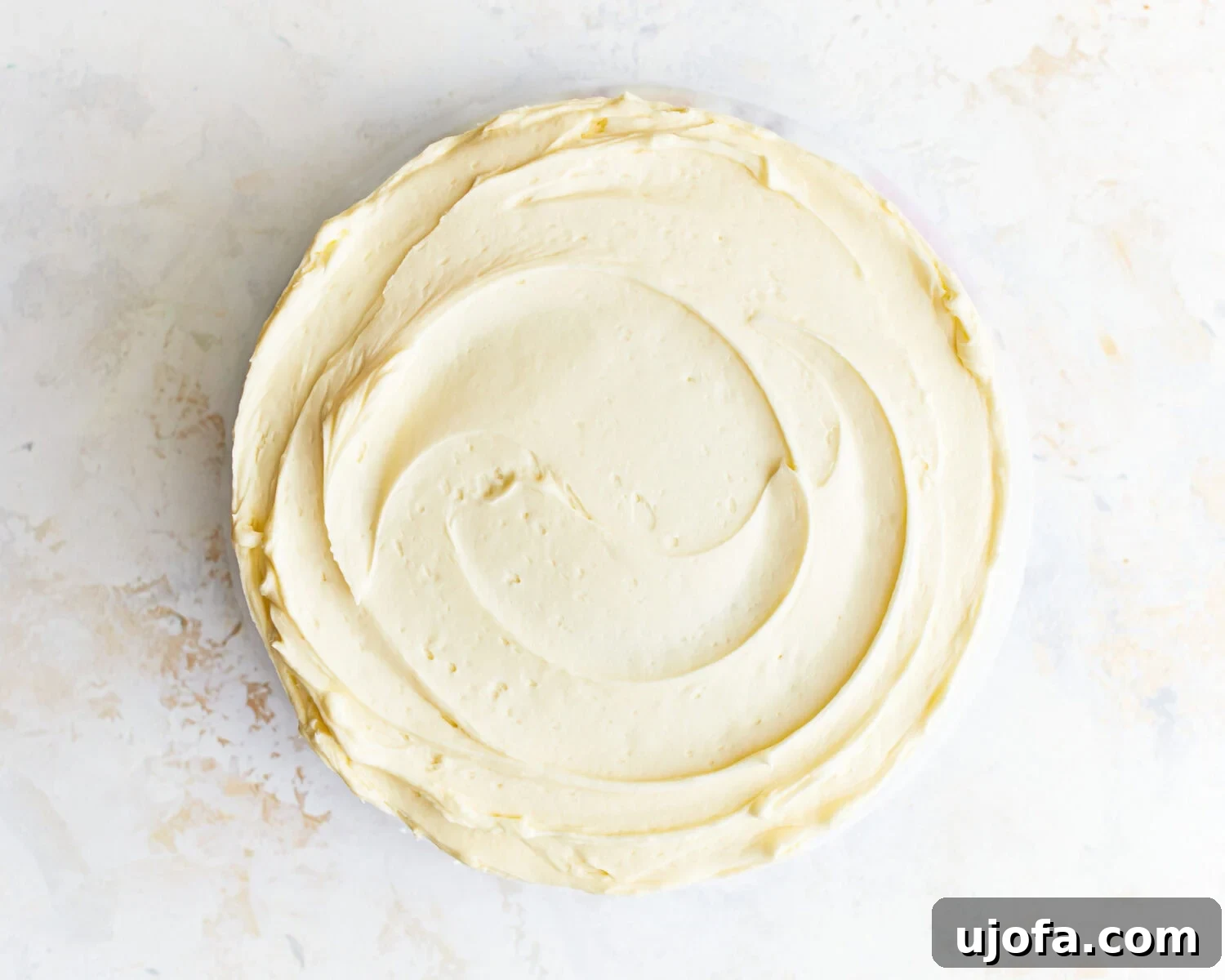Frosted Gluten-Free Vanilla Cake Overhead view of a beautifully frosted gluten-free vanilla cake.