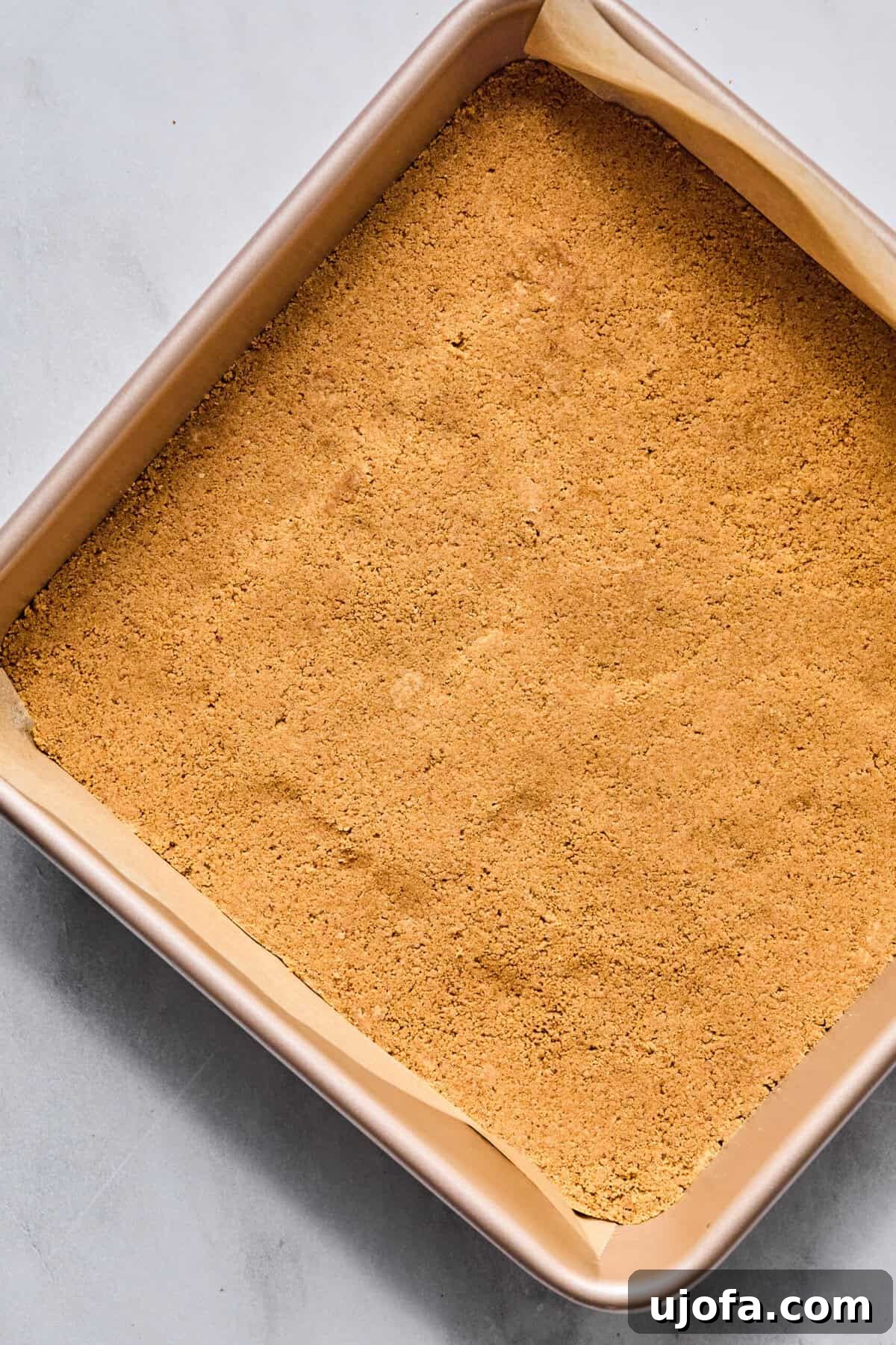 Easy Protein-Packed Pumpkin Cheesecake Bars 6 graham cracker crumbs pressed into a square pan