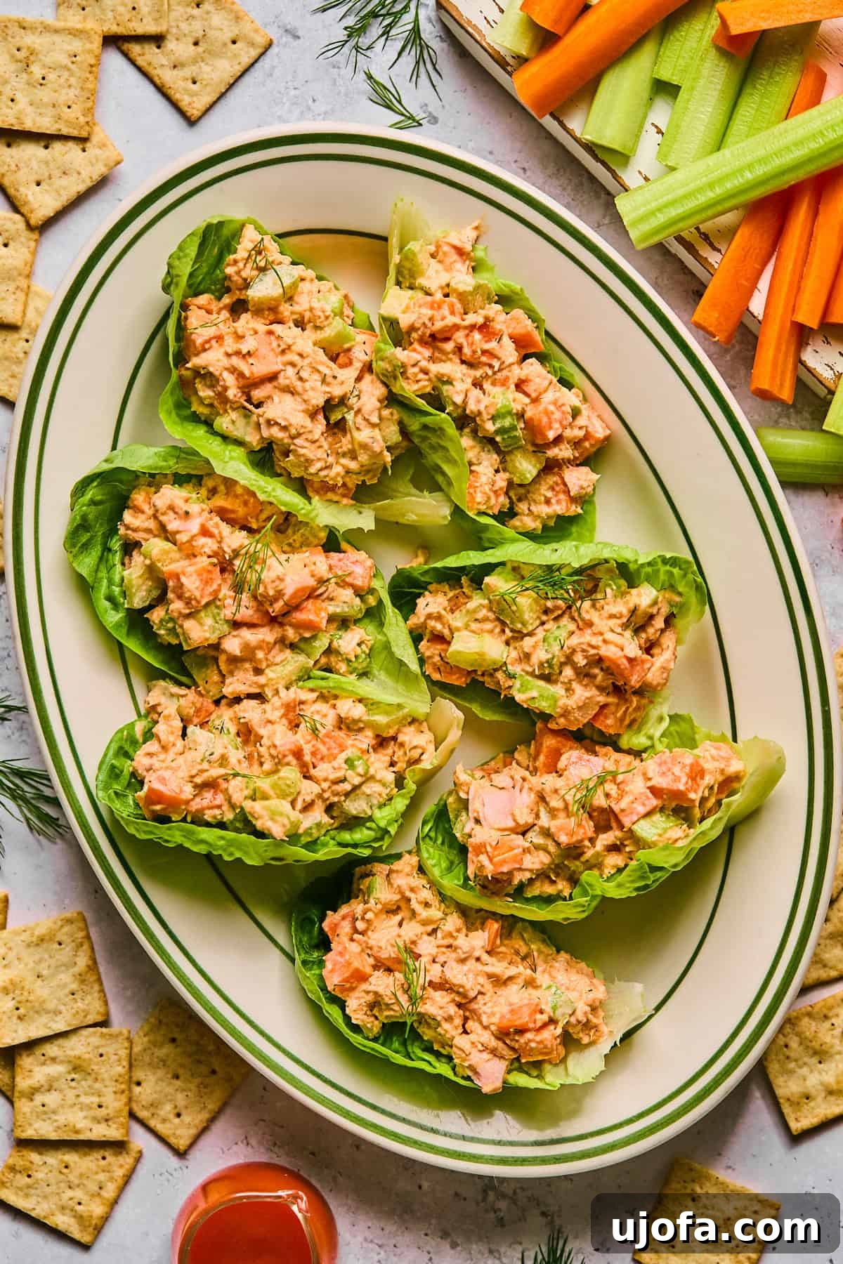 A platter of buffalo tuna salad served in crisp lettuce cups, garnished with fresh herbs