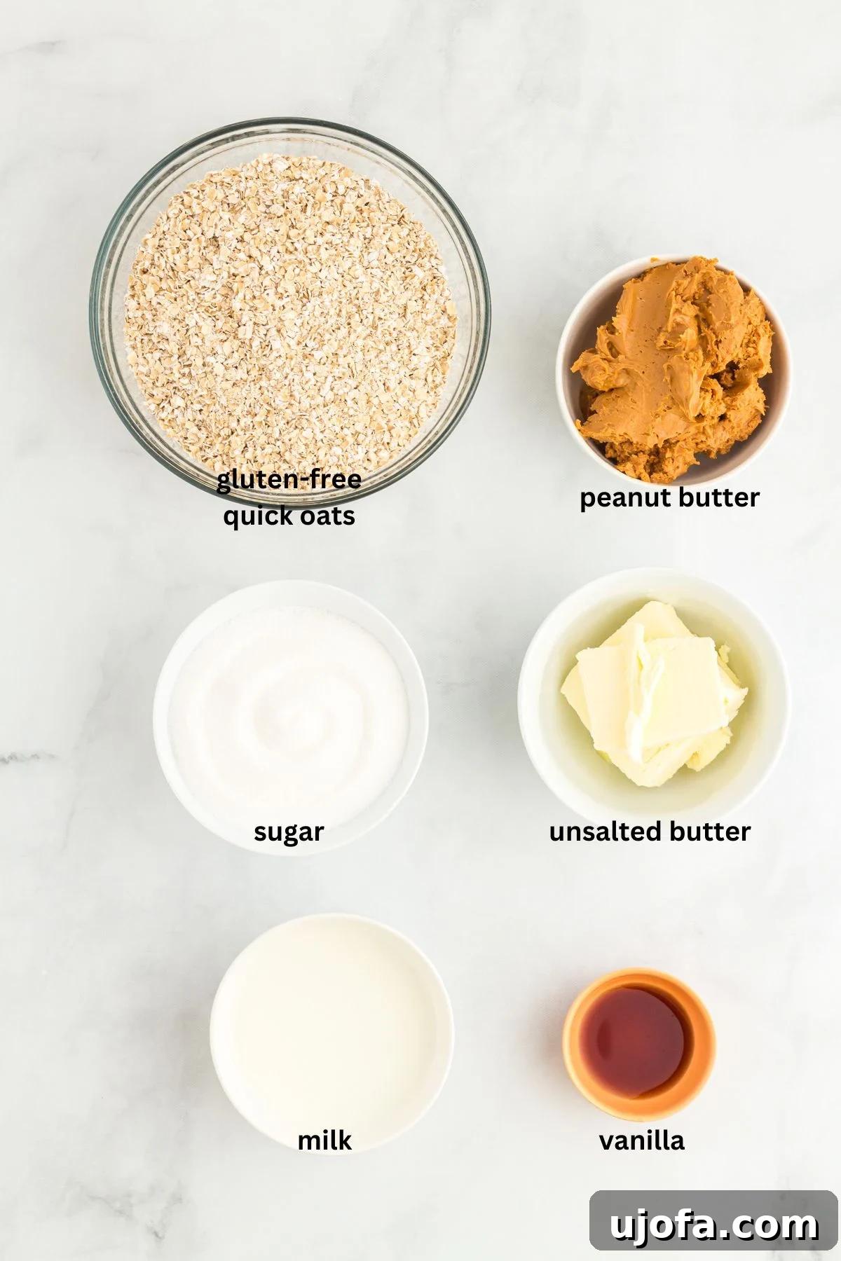 Easy Peanut Butter No-Bake Cookies 3 A vibrant overhead shot displaying all the carefully measured ingredients for gluten-free peanut butter no-bake cookies, neatly arranged on a white surface.