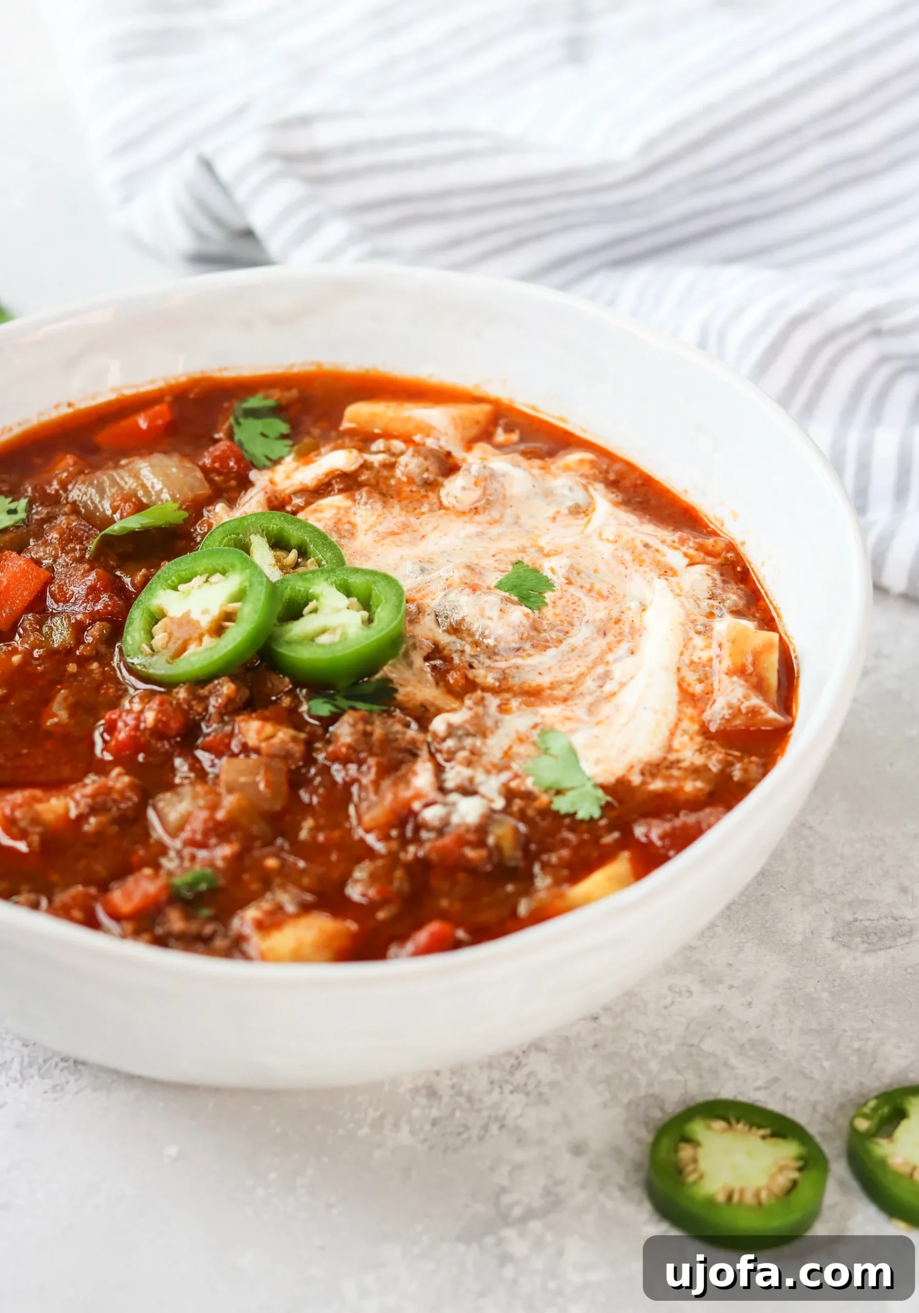 Slow Cooker Sweet Potato Chili simmering in a crock pot, revealing its rich texture and vibrant colors.