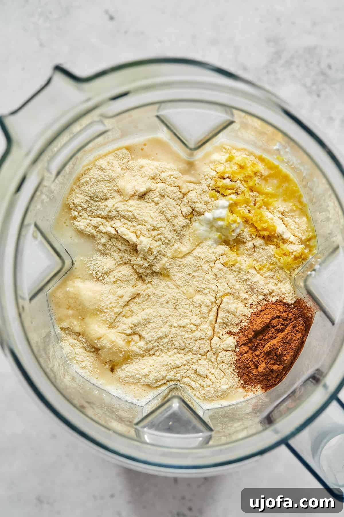 All the wet ingredients for the protein French toast custard, including eggs, milk, and spices, combined in a blender.