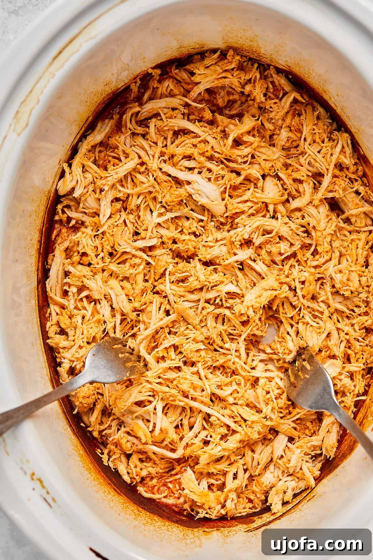 shredding chicken with 2 forks