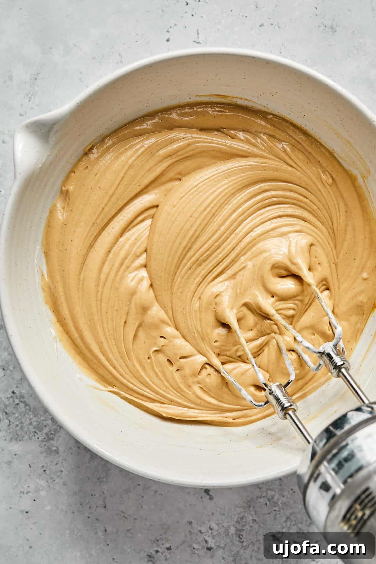 No-Bake Vegan Peanut Butter Bliss 11 The peanut butter pie filling after being mixed with Cocowhip, appearing light and fluffy in a bowl.