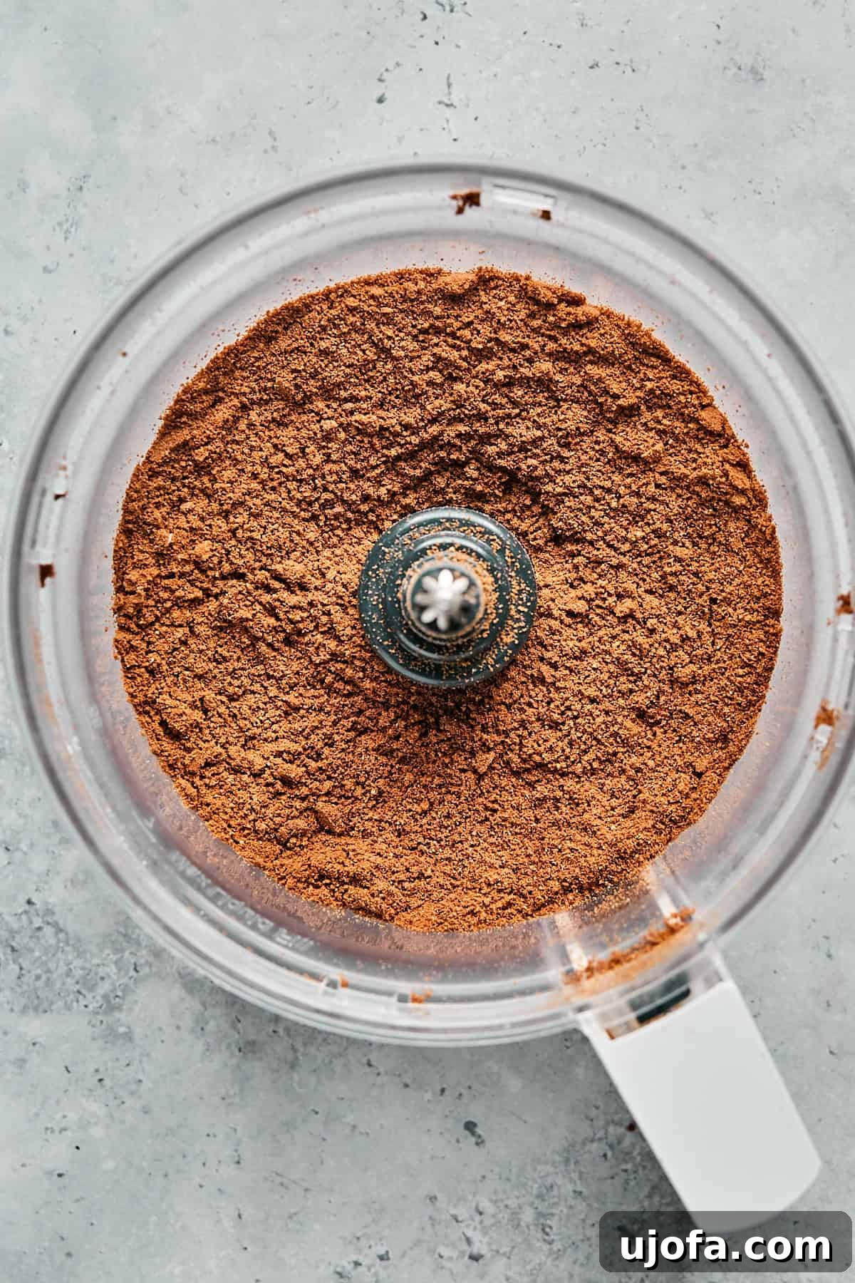 No-Bake Vegan Peanut Butter Bliss 5 Ground chocolate cookies in a food processor, resembling fine sand.