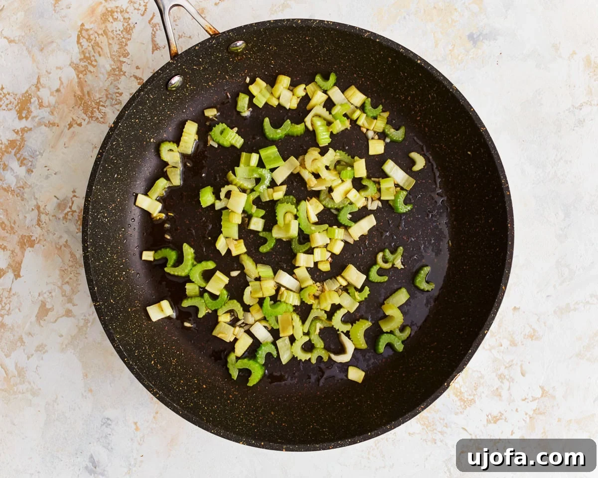 Flavorful Gluten-Free Stuffing 8 Celery and garlic sauteing in a skillet