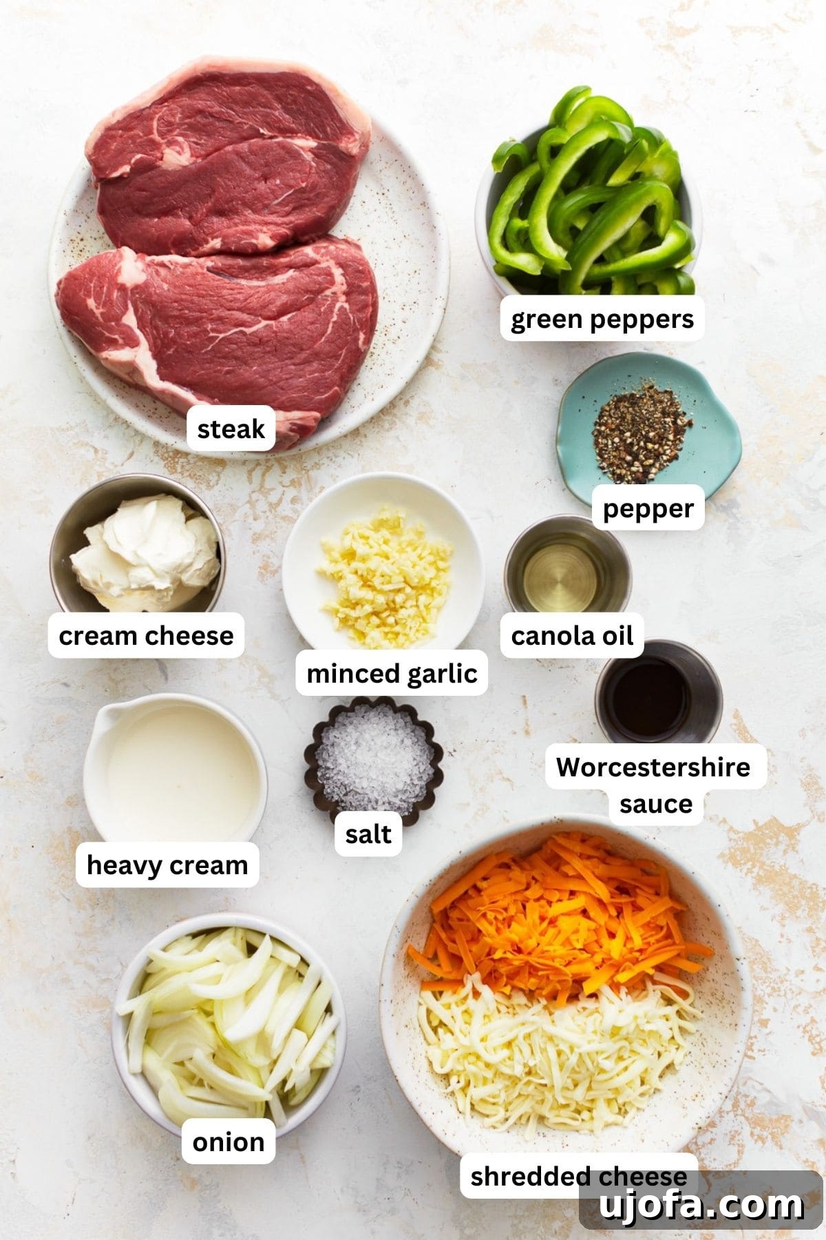 Ingredients for making Philly Cheesesteak Casserole laid out on a countertop
