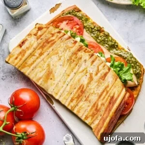 High Protein Cottage Cheese Flatbread Gluten Free Flourless 10 Cottage cheese flatbread stuffed with various fillings on a cutting board, highlighting its versatility.