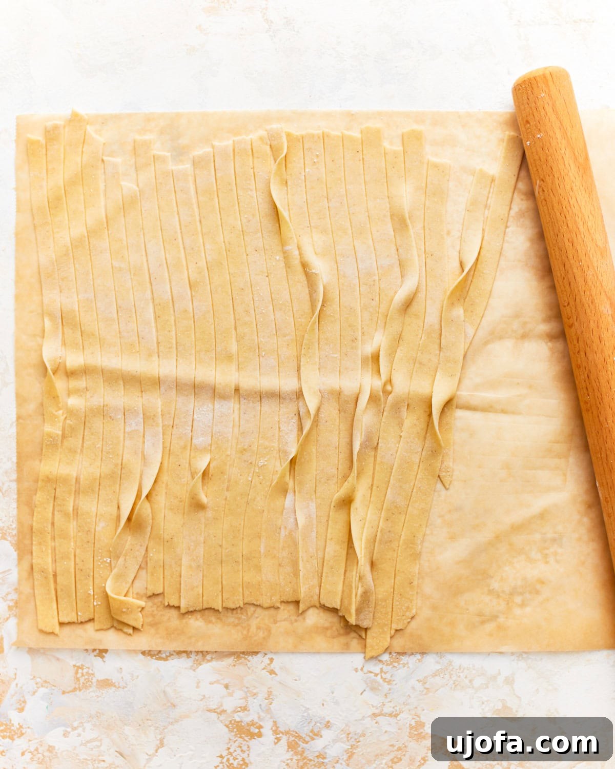gluten-free pasta dough cut into strips.