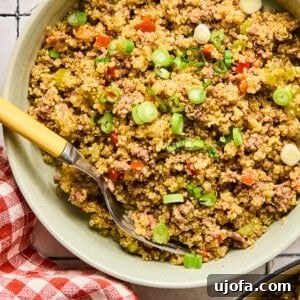 Dirty quinoa in a bowl with a red and white checkered napkin next to it