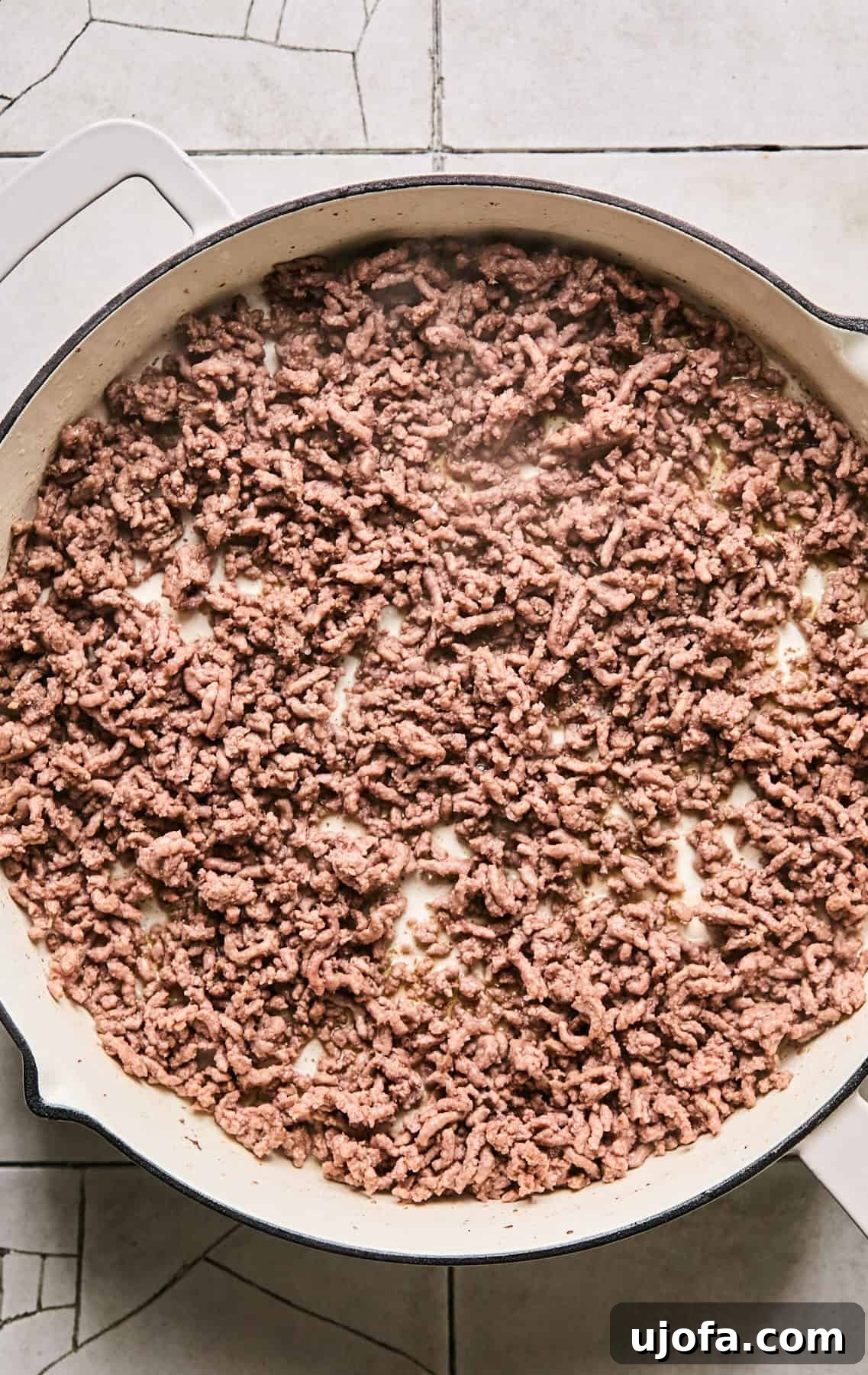 Dirty Quinoa: A Flavorful and Healthy Take on a Classic 4 Ground beef cooking and browning in a large skillet over medium-high heat.