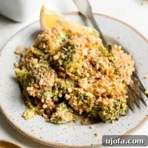a serving of gluten free broccoli casserole on a white dish