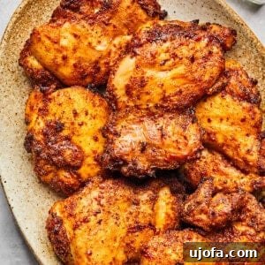 Crispy Juicy Air Fryer Boneless Thighs 14 air fryer chicken thighs on a platter