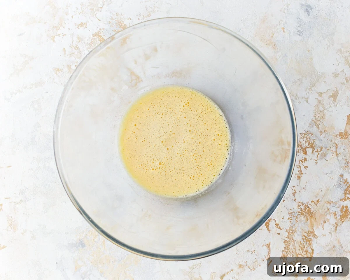 Fluffy Cloud Bread 5 egg yolk mixture in a glass bowl.